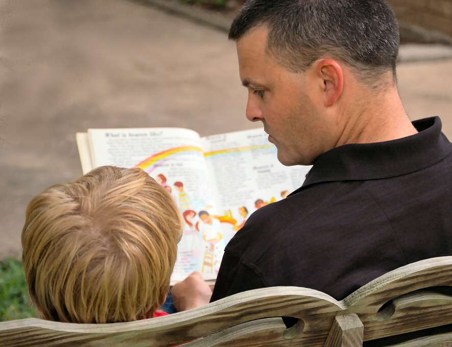 LVWCME Adult and Child Reading a Book